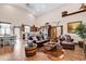 Open-concept living room with hardwood floors, barn door, and rustic furnishings at 7299 Cartrette Rd., Aynor, SC 29511
