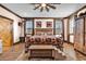 Charming bedroom featuring rustic decor, wood floors, and a unique barn-themed design at 7299 Cartrette Rd., Aynor, SC 29511