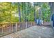 An eye-level view of the wooden deck overlooking the home's large backyard and wooded area at 121 Grand Palm Ct., Myrtle Beach, SC 29579