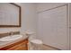 Well-lit bathroom featuring a vanity, toilet, and linen closet for convenient storage at 121 Grand Palm Ct., Myrtle Beach, SC 29579