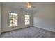 Bedroom with a ceiling fan, neutral carpet, and natural light at 121 Grand Palm Ct., Myrtle Beach, SC 29579