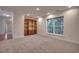 Carpeted room with built-in shelving and a bright window at 121 Grand Palm Ct., Myrtle Beach, SC 29579