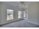 Carpeted bedroom with multiple windows providing great light at 121 Grand Palm Ct., Myrtle Beach, SC 29579