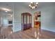 Elegant dining room showcases wood floors, detailed trim work, and seamless flow into the kitchen at 121 Grand Palm Ct., Myrtle Beach, SC 29579