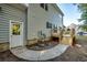 A side exterior view of the home featuring a light gray siding, a wooden deck and a door leading to backyard at 121 Grand Palm Ct., Myrtle Beach, SC 29579