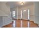 Elegant foyer with hardwood floors, a staircase, and a door with decorative glass at 121 Grand Palm Ct., Myrtle Beach, SC 29579