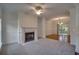Bright living room with fireplace, plush carpet, and access to the dining area at 121 Grand Palm Ct., Myrtle Beach, SC 29579