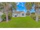 Spacious backyard with a grill and mature landscaping at 133 Junco Circle, Longs, SC 29568