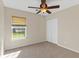 Bedroom featuring neutral carpet, bright window, and closet at 133 Junco Circle, Longs, SC 29568