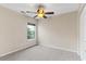 Bedroom with neutral carpet and walls, ceiling fan, and window at 133 Junco Circle, Longs, SC 29568