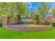 The brick entrance to Wakefield community showcases landscaped greenery with the community name at 133 Junco Circle, Longs, SC 29568