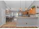 Inviting kitchen showcasing a breakfast bar, stainless steel appliances, and seamless access to the dining area at 133 Junco Circle, Longs, SC 29568