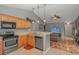 Well-equipped kitchen with modern appliances and a breakfast bar connecting to the cozy living area at 133 Junco Circle, Longs, SC 29568