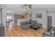 Open concept living space with vaulted ceilings, wood floors and open access to the kitchen at 133 Junco Circle, Longs, SC 29568