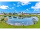 Scenic view of the pond reflecting the blue sky surrounded by manicured grounds in a neighborhood at 133 Junco Circle, Longs, SC 29568