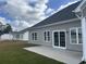 Spacious backyard with a concrete patio and sliding glass doors that enhance outdoor living at 2327 King Farm Rd., Aynor, SC 29511