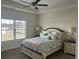Cozy bedroom with a large window, ceiling fan and comfortable furnishings at 2327 King Farm Rd., Aynor, SC 29511