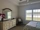 Bright bedroom featuring a large window with natural light and comfortable furnishings at 2327 King Farm Rd., Aynor, SC 29511