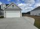 Charming home featuring a wide driveway leading to an attached two car garage at 2327 King Farm Rd., Aynor, SC 29511