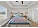 Inviting main bedroom featuring a tray ceiling, plush carpet, and a comfortable bed, creating a serene and restful retreat at 2327 King Farm Rd., Aynor, SC 29511