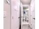 Hallway view of a bathroom with a white vanity and tile flooring at 2557 7B Pete Dye Dr. # 704, North Myrtle Beach, SC 29582