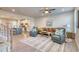 Open-concept living room featuring wood floors, comfortable seating, and ample natural light at 2557 7B Pete Dye Dr. # 704, North Myrtle Beach, SC 29582
