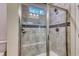 Tiled shower with glass door and a built-in bench in a modern bathroom at 2557 7B Pete Dye Dr. # 704, North Myrtle Beach, SC 29582