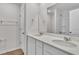 Sleek bathroom showcasing double sinks with modern fixtures and white cabinetry at 794 Nw Palm Frond Way # 48, Calabash, NC 28467