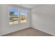 Neutral bedroom features large windows providing ample natural light at 794 Nw Palm Frond Way # 48, Calabash, NC 28467