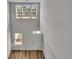 Sunlit two-story foyer features hardwood floors and bright natural light at 794 Nw Palm Frond Way # 48, Calabash, NC 28467