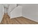 Hallway with wood-look flooring, white trim, and doors leading to various rooms in the home at 794 Nw Palm Frond Way # 48, Calabash, NC 28467