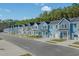 Row of charming two-story townhomes in a well-maintained community with manicured lawns at 794 Nw Palm Frond Way # 48, Calabash, NC 28467
