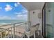 Relax on this balcony with chairs and enjoy stunning views of the beach and ocean at 1207 S Ocean Blvd. # 51408, Myrtle Beach, SC 29577