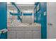 Bright bathroom with a large mirror, white vanity, and ample storage space, creating a clean and refreshing atmosphere at 1207 S Ocean Blvd. # 51408, Myrtle Beach, SC 29577