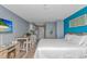 Comfortable bedroom with a full bed, television, kitchen, and an open-concept living area at 1207 S Ocean Blvd. # 51408, Myrtle Beach, SC 29577