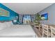 Comfortable bedroom with a cozy seating area, television, and balcony access at 1207 S Ocean Blvd. # 51408, Myrtle Beach, SC 29577