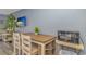 Cozy dining area featuring a wooden table, chairs, microwave, and a television, perfect for enjoying meals at 1207 S Ocean Blvd. # 51408, Myrtle Beach, SC 29577