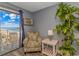Relaxing space featuring an armchair, table, and balcony access with ocean views, perfect for unwinding at 1207 S Ocean Blvd. # 51408, Myrtle Beach, SC 29577