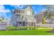 Backyard features a lush lawn, black chain link fence and a large deck area on the back of the home at 136 Kenzgar Dr., Myrtle Beach, SC 29588