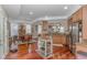The kitchen features stainless steel appliances, light wood cabinetry, granite countertops, and wood floors throughout at 136 Kenzgar Dr., Myrtle Beach, SC 29588