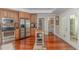 Well-lit kitchen with stainless steel appliances and an island providing space for cooking at 136 Kenzgar Dr., Myrtle Beach, SC 29588