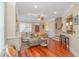 Open-concept living area with hardwood floors, comfortable seating and a partial bar at 136 Kenzgar Dr., Myrtle Beach, SC 29588