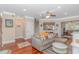 Bright living room features hardwood floors and a comfortable seating arrangement at 136 Kenzgar Dr., Myrtle Beach, SC 29588