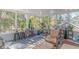 Enclosed sunroom with abundant natural light, comfortable seating, and lots of plants throughout at 136 Kenzgar Dr., Myrtle Beach, SC 29588