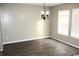 Well-lit dining room with modern chandelier and neutral wall color at 156 Weeping Willow Dr., Myrtle Beach, SC 29579