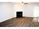 Open living room with a cozy fireplace and sliding glass doors to the exterior at 156 Weeping Willow Dr., Myrtle Beach, SC 29579
