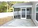 Covered back porch perfect for enjoying the outdoors, featuring a concrete base and screen walls at 156 Weeping Willow Dr., Myrtle Beach, SC 29579