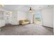 Bright living room with carpet, ceiling fan, and sliding doors to a balcony with a view at 2241 Waterview Dr. # 437, North Myrtle Beach, SC 29582