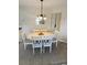 Dining area with round table and white chairs at 2268 Essex Dr. # G, Surfside Beach, SC 29575