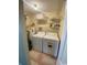 Convenient laundry room with washer, dryer, and shelving at 2268 Essex Dr. # G, Surfside Beach, SC 29575